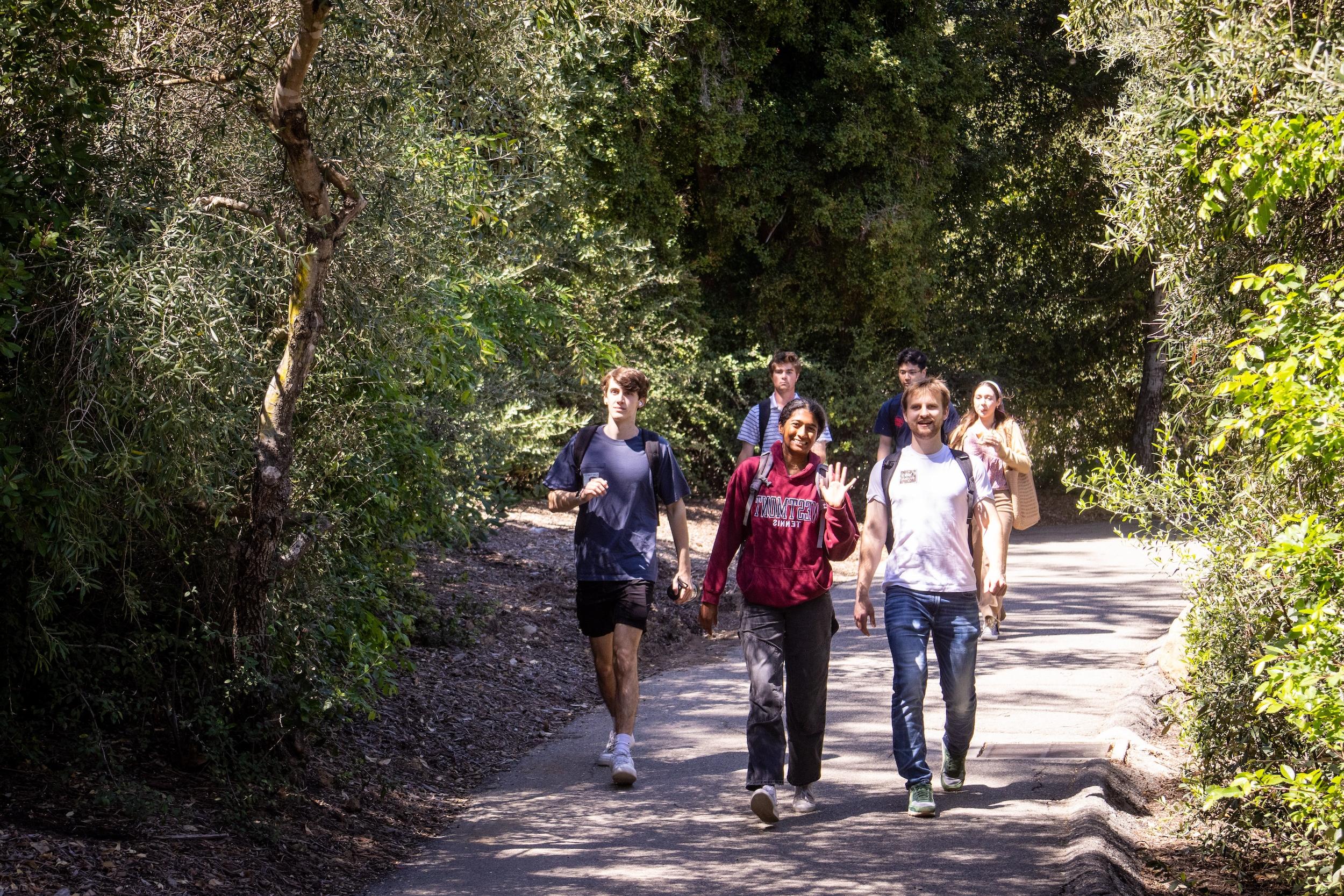 students walking on campus to class